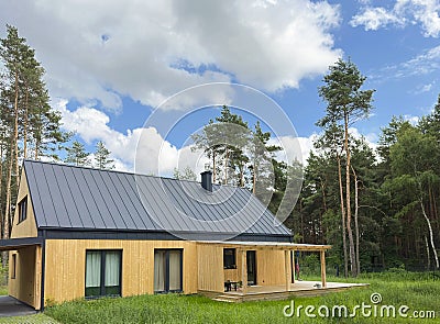 Modern energy saving house surrounded by green nature Stock Photo