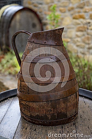 Equipment for producing of red, rose and white wine on South of France in Provence. Wooden grape juice jug Stock Photo