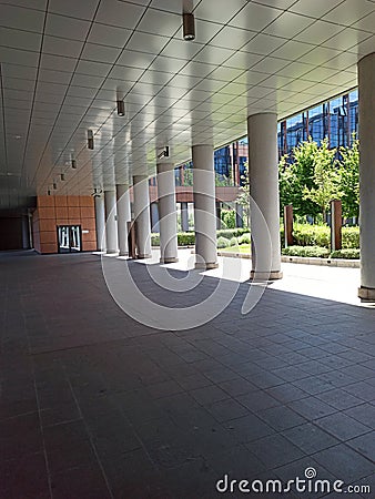 Modern example of architecture with an arcade full of columns in Perspective in Bologna Italy Stock Photo