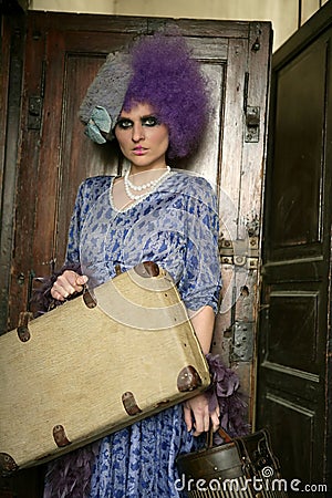 Modern fashion vanguard woman with baggage Stock Photo