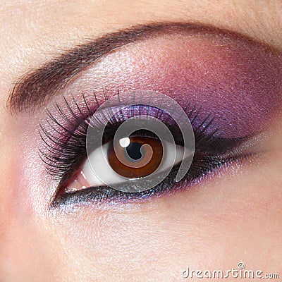 Modern fashion violet makeup of a female eye Stock Photo