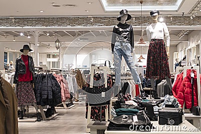 Modern fashionable brand interior of clothing store inside shopping center Stock Photo