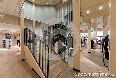 Modern fashionable brand interior of clothing store inside shopping center Editorial Stock Photo