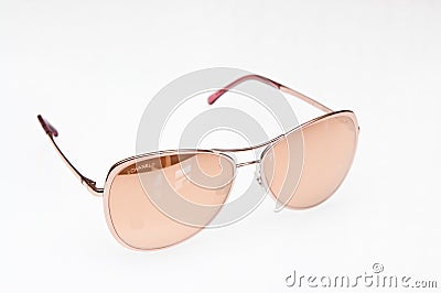 Fashionable beige sunglasses of Chanel brand Editorial Stock Photo