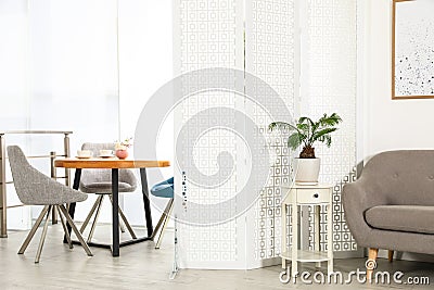 Modern folding screen in room interior Stock Photo