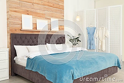 Modern folding screen in stylish bedroom Stock Photo