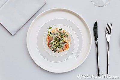 Modern French cuisine: Top view of lobster tail salad including lobster, asparagus and roasted sunflower seeds with white sauce. Stock Photo