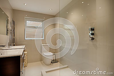 Modern fully tiled luxury shower room Stock Photo