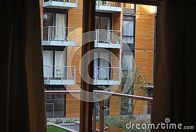 A modern furnished apartment with a balcony - wooden facade Stock Photo