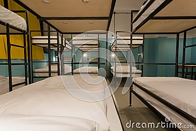 Modern furniture, bunk beds in new style hostel with dormitory rooms for many people Stock Photo