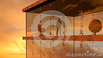 A modern glass building with a man looking the sunset Stock Photo