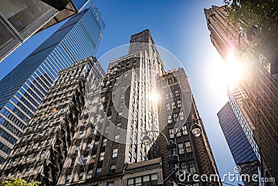 Modern glass and classic tall office buildings in New York. A perspective view from below Stock Photo