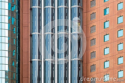 Modern glass elevators or lifts in new business building Stock Photo