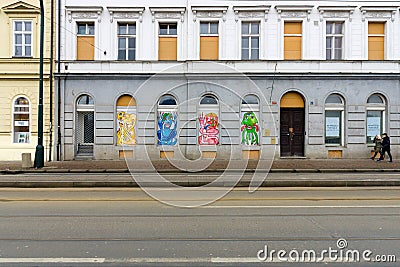 Modern graffiti in the windows of old houses in Prague Editorial Stock Photo