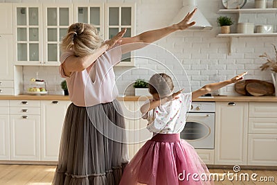 Modern grandmother dab dancing with small granddaughter Stock Photo