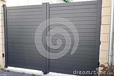 Modern gray gate of suburb detached house Stock Photo