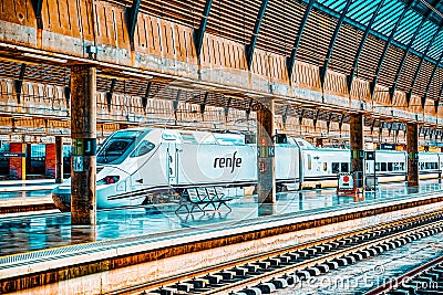 Modern hi-speed passenger train of Spanish railways company-Renf Editorial Stock Photo