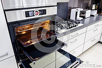 Modern hi-tek kitchen, oven with open door Stock Photo