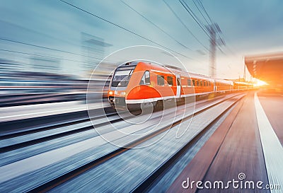 Modern high speed red passenger commuter train. Railway station Stock Photo