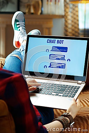 Modern hipster getting help from chat robot Stock Photo