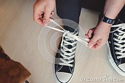 Modern hipster wedding, groom wearing sneakers Stock Photo