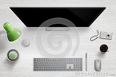 Modern home desk workplace. Computer display with keyboard, mouse, pen, dial, lamp, plant, cup of coffee and digital camera Stock Photo