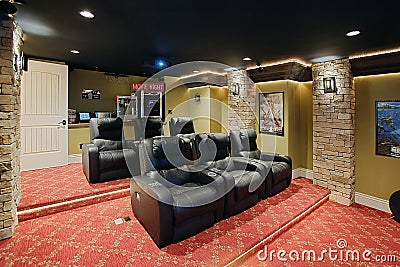 A modern home theater with comfortable seating. Editorial Stock Photo