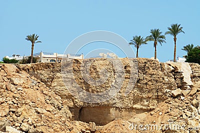 Modern hotel on rocks in exotic country Stock Photo