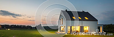 Modern house with garden at night Stock Photo