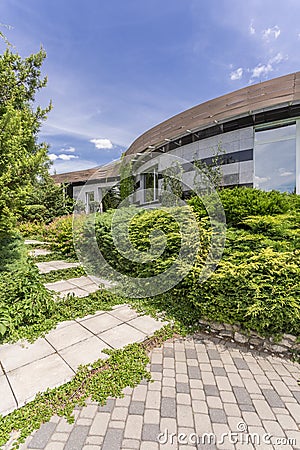 Modern housefront surrounded by plants Stock Photo