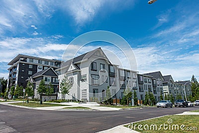 Modern Houses next to a wide asphalt road in Surrey, Canada Editorial Stock Photo