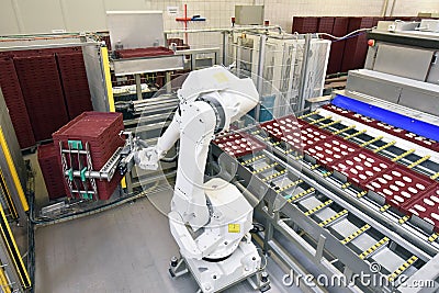 Modern industrial robot in food company - industrial production of bakery products on an assembly line Stock Photo