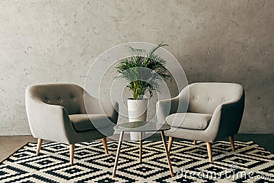 modern interior with vintage furniture in loft style with concrete wall Stock Photo