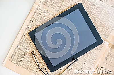 Modern iPad Tablet computer and Financial Times magazine Editorial Stock Photo