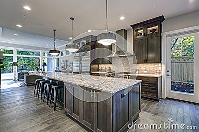 Modern kitchen with brown kitchen cabinets Stock Photo