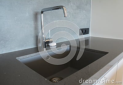 Modern kitchen chrome faucet and ceramic kitchen sink Stock Photo