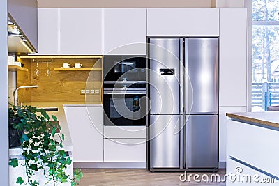 Modern kitchen design in light interior. Stock Photo