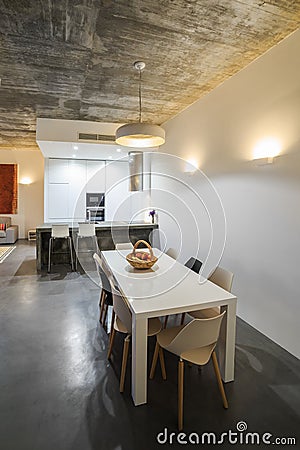 Modern kitchen with gray tile floor and white wall Stock Photo