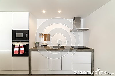 modern kitchen with gray tile and white wall Stock Photo