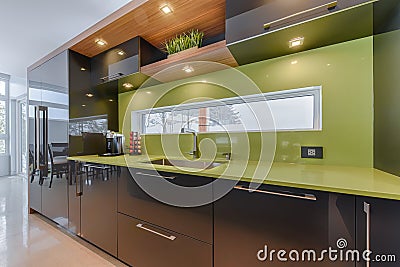 Modern kitchen with green quartz counter top Stock Photo