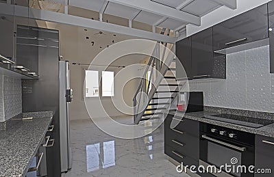 Modern kitchen in a luxury duplex apartment Stock Photo