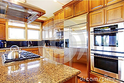 Modern kitchen room interior with wooden cabinets, granite count Stock Photo