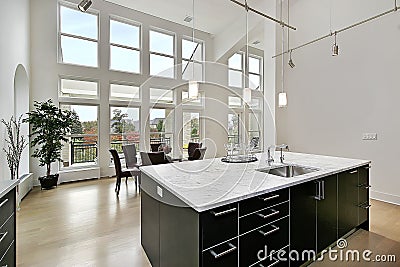 Modern kitchen with two story windows Stock Photo