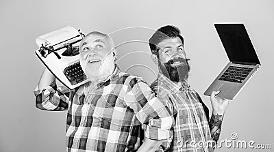 Modern life and remnants of past. Senior man with typewriter and hipster with laptop. Master new technologies. Men work Stock Photo