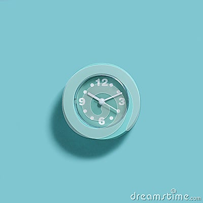 Modern light blue alarm clock on blue background Stock Photo