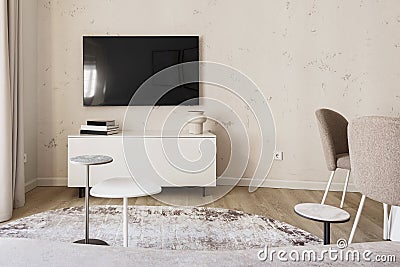 Modern living room interior in pastel colours with creamy white furniture. Trendy minimalistic interior concept. Stock Photo