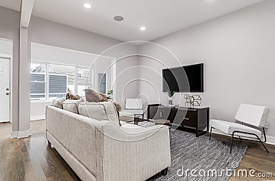 Modern living room with a mounted television. Editorial Stock Photo