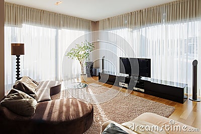 Modern living room with sofa and tv set. Stock Photo