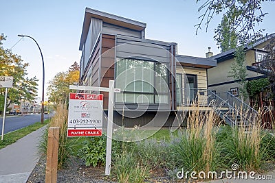 A modern looking house for sale during fall Editorial Stock Photo