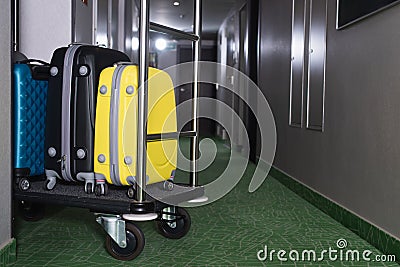 modern luggage on bell cart in Stock Photo